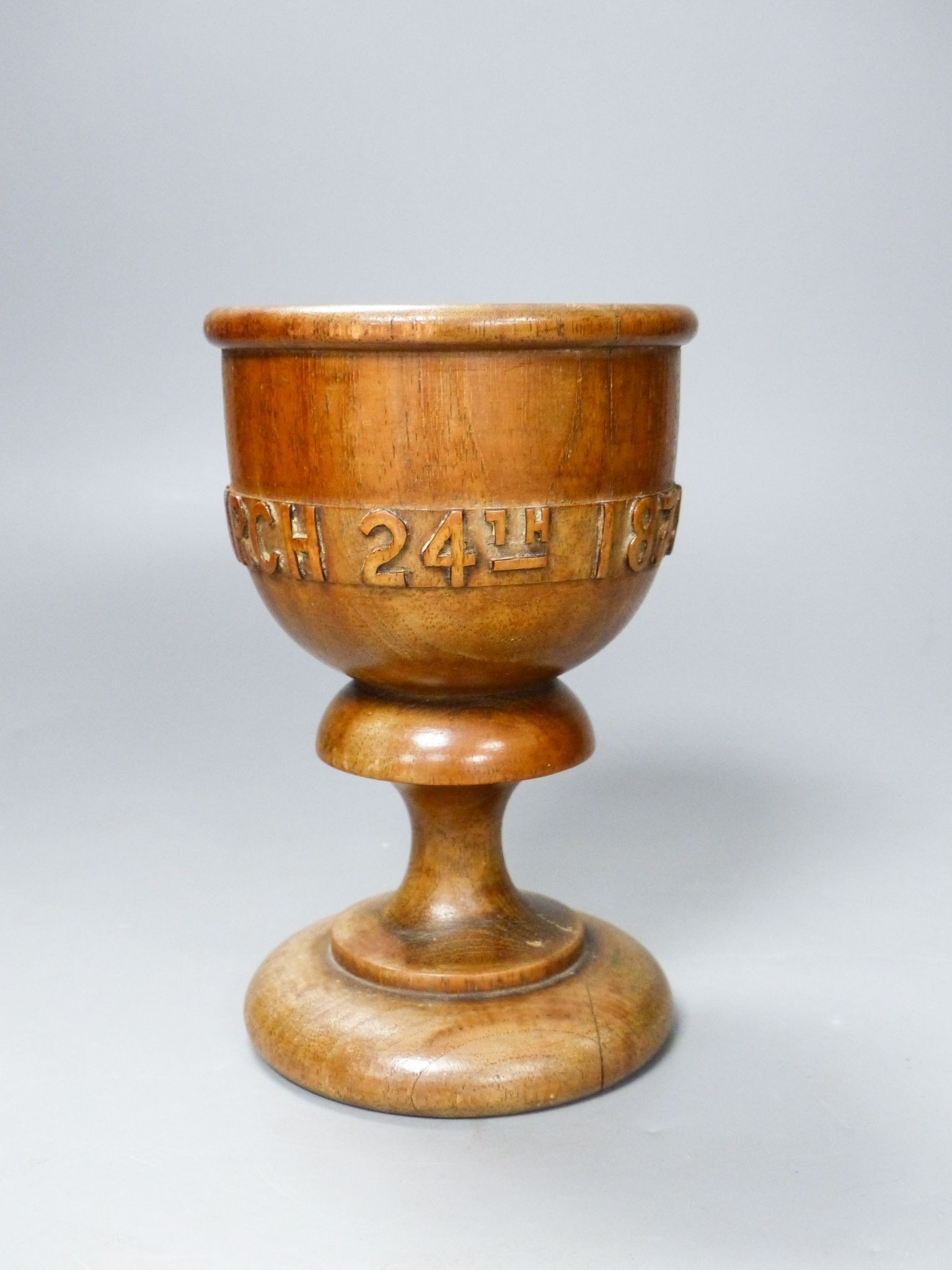 A turned and carved wood goblet made from the timber of the ship Eurydice and dated March 24th 1878, 15cm 15cm